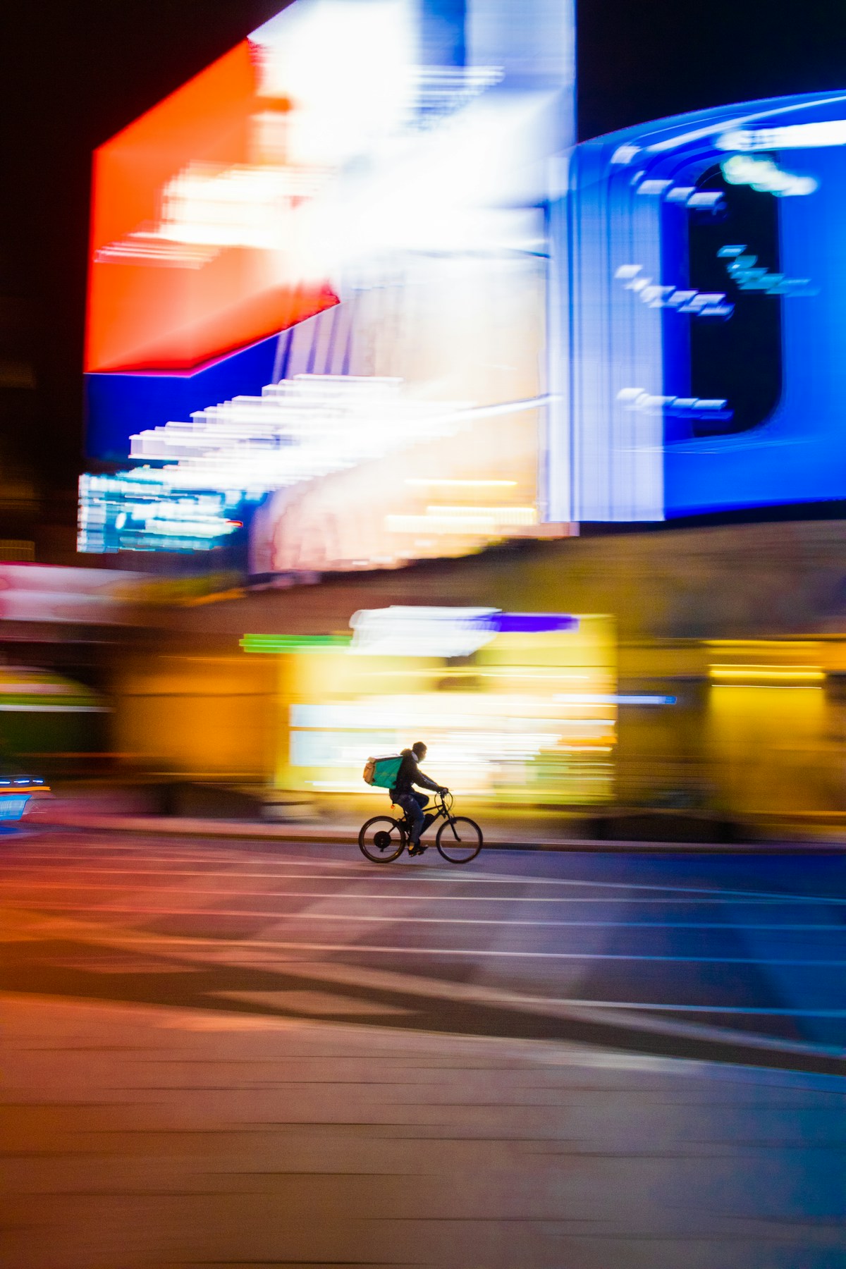 Delivery driver holding a takeout order bag smiling outside a restaurant